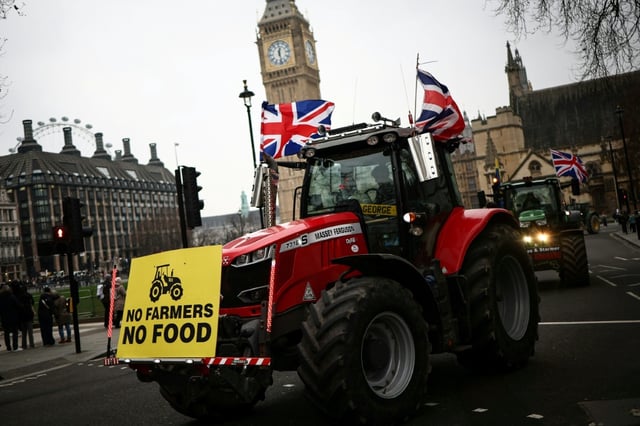 Farmers drive tractors in front of Big Ben, at Westminster Palace, home to the Houses of Parliament, during a demonstration to protest changes to inheritance tax rules