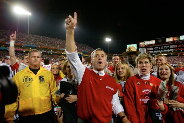 Ohio State coach Jim Tressel celebrates after his Buckeyes defeated the Miami Hurricanes 31=24 in double overtime in the BCS national championship game on Jan. 3, 2003, in Tempe, Arizona.