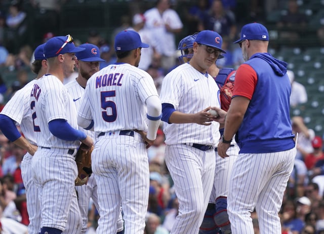 Javier Assad #72 of the Chicago Cubs is removed by manager David Ross #3 of the Chicago Cubs during the fifth inning of a game against the St. Louis Cardinals at Wrigley Field on August 23, 2022 in Chicago, Illinois.