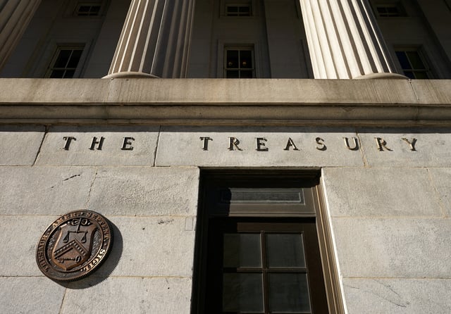 A view shows a bronze seal beside a door at the U.S. Treasury building in Washington, U.S., January 20, 2023.  REUTERS/Kevin Lamarque/File Photo