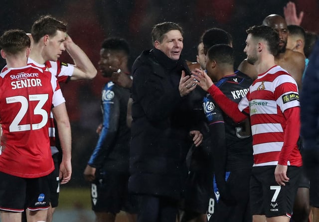 Soccer Football - FA Cup - Fourth Round - Doncaster Rovers v Crystal Palace - Eco-Power Stadium, Doncaster, Britain - February 10, 2025 Crystal Palace manager Oliver Glasner shakes hands with Doncaster Rovers' Luke Molyneux REUTERS/Scott Heppell