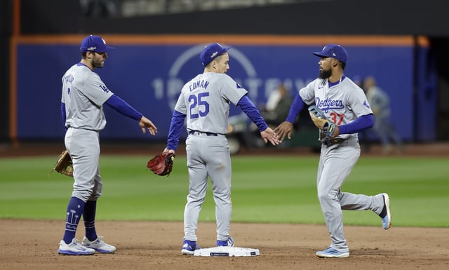 NEW YORK, NEW YORK - OCTOBER 16: (NEW YORK DAILIES OUT) Chris Taylor #3, Tommy Edman #25 and Teoscar Hernandez #37 of the Los Angeles Dodgers celebrate after Game Three of the National League Championship Series against the New York Mets at Citi Field on October 16, 2024 in New York City.
