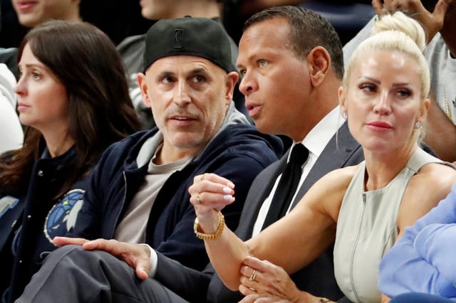 Minnesota Timberwolves and Lynx minority owners Marc Lore and Alex Rodriguez talk in the fourth quarter of the game against the Phoenix Suns at Target Center.