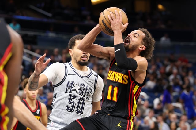 Feb 10, 2025; Orlando, Florida, USA; Atlanta Hawks guard Trae Young (11) drives to the basket against the Orlando Magic in the second quarter at Kia Center. Mandatory Credit: Nathan Ray Seebeck-Imagn Images
