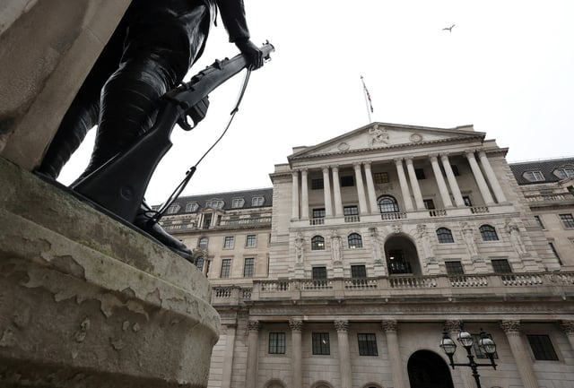 A bird flies over the Bank of England building in London, Britain, February 3, 2025.  REUTERS/Toby Melville/File Photo