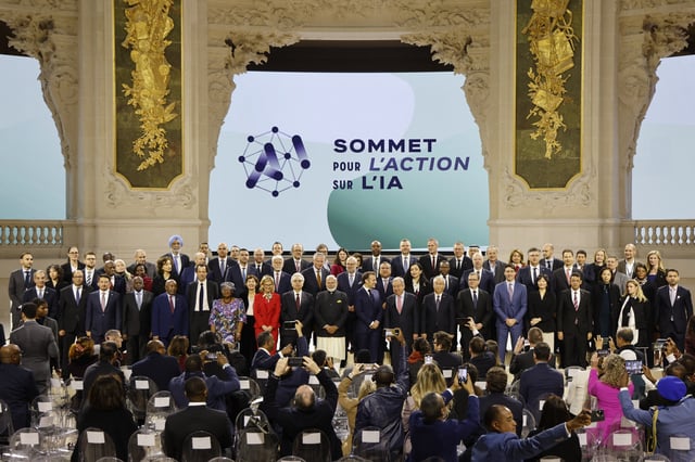 France's President Emmanuel Macron (front C) poses for a group picture with world leaders and attendees at the end of the plenary session of the Artificial Intelligence (AI) Action Summit, at the Grand Palais, in Paris, on February 11, 2025. (Photo by Ludovic MARIN / AFP) (Photo by LUDOVIC MARIN/AFP via Getty Images)