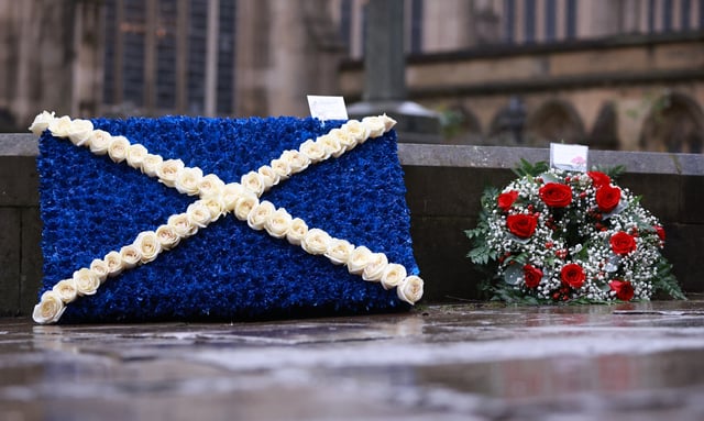 Soccer Football - Funeral of former Scotland and Manchester United footballer Denis Law - Manchester Cathedral, Manchester, Britain - February 11, 2025 A saltire wreath laid by Rod Stewart is seen outside the cathedral at the funeral of former Scotland and Manchester United footballer Denis Law Action Images via Reuters/Ed Sykes
