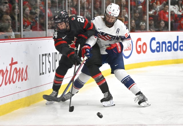 Apr 10, 2023; Brampton, Ontario, CAN;  Canada forward Natalie Spooner (24) battles for the puck with USA defender Lee Stecklein (2) in the first period at CAA Center. Mandatory Credit: Dan Hamilton-USA TODAY Sports/File Photo