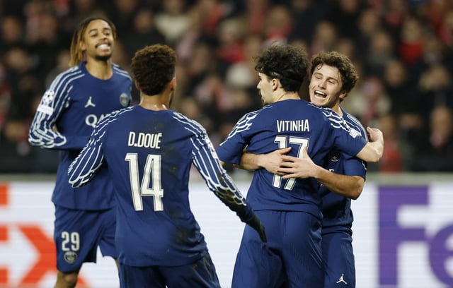 Soccer Football - Champions League - Knockout Phase Playoff - First Leg - Brest v Paris St Germain - Stade de Roudourou, Guingamp, France - February 11, 2025 Paris St Germain's Vitinha celebrates scoring their first goal with Paris St Germain's Joao Neves and Paris St Germain's Desire Doue REUTERS/Stephane Mahe