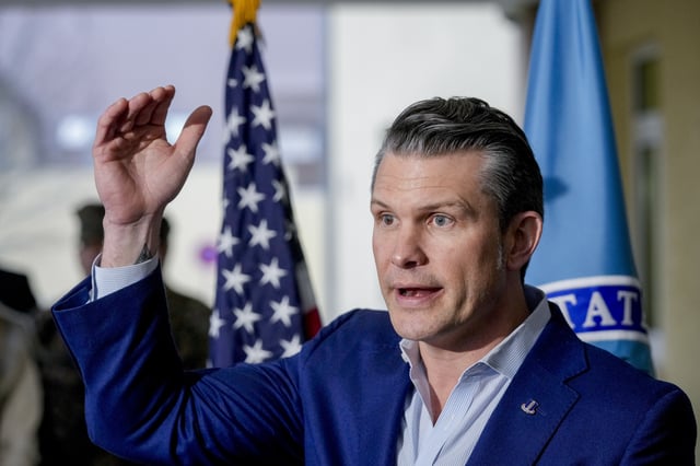 US Secretary of Defense Pete Hegseth talks to the media during his visit to the headquarters of U.S. European Command and Africa Command at the Africa Command at Kelly Barracks in Stuttgart Germany, Tuesday, Feb. 11, 2025. (AP Photo/Michael Probst)