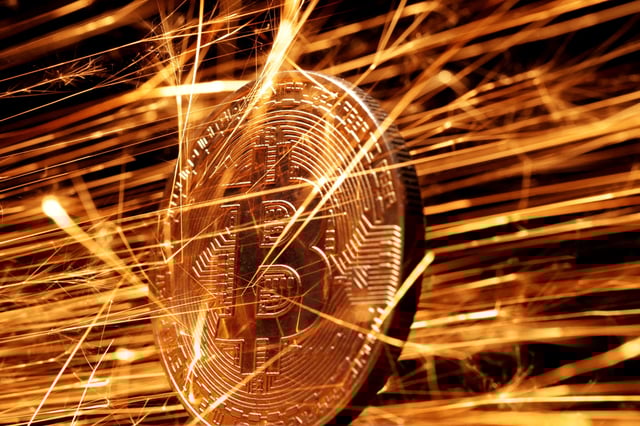 Sparks strike representation of cryptocurrency Bitcoin in this illustration taken November 24, 2024. REUTERS/Dado Ruvic/Illustration/File Photo