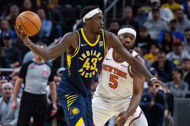 Feb 11, 2025; Indianapolis, Indiana, USA; Indiana Pacers forward Pascal Siakam (43) holds the ball while New York Knicks forward Precious Achiuwa (5) defends in the second half at Gainbridge Fieldhouse. Mandatory Credit: Trevor Ruszkowski-Imagn Images