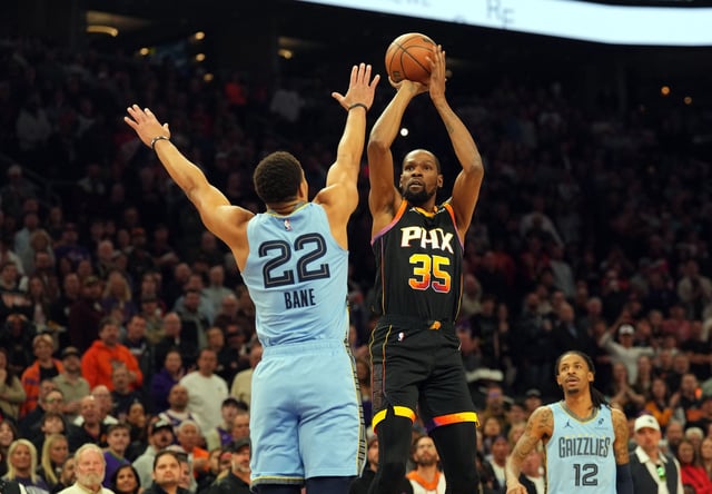 Feb 11, 2025; Phoenix, Arizona, USA; Phoenix Suns forward Kevin Durant (35) shoots over Memphis Grizzlies guard Desmond Bane (22) during the first half at Footprint Center. Mandatory Credit: Joe Camporeale-Imagn Images