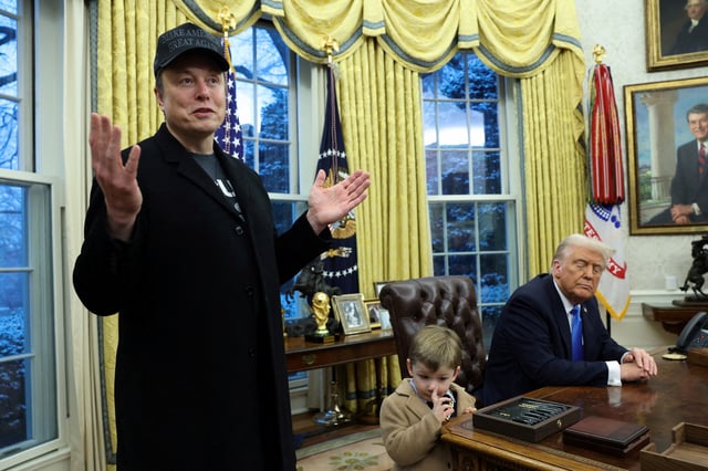 Elon Musk speaks as his son X ? A-12 and U.S. President Donald Trump listen in the Oval Office of the White House in Washington, D.C., U.S., February 11, 2025.   REUTERS/Kevin Lamarque