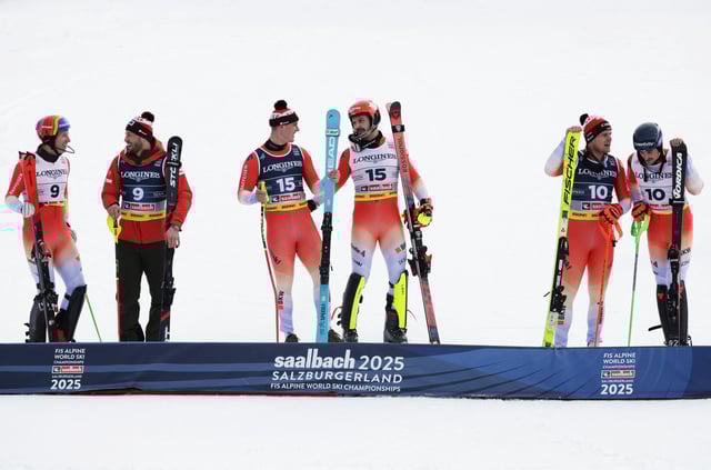 Alpine Skiing - FIS Alpine World Ski Championships - Men's Team Combined - Saalbach, Austria - February 12, 2025 Switzerland's Tanguy Nef with teammates Alexis Monney, Stefan Rogentin, Marc Rochat, Franjo von Allmen and Loic Meillard after their slalom run REUTERS/Leonhard Foeger
