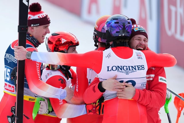 (From L) Switzerland's Franjo von Allmen,  Loic Meillard,  Marc Rochat and Switzerland's Alexis Monney celebrate