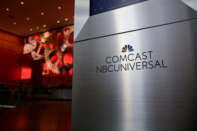 A view shows a signage of Comcast and NBC Universal in the lobby of the corporate headquarters of Comcast, which announced plans to spin-off the bulk of its fading NBCUniversal cable TV networks, including MSNBC and CNBC, in Philadelphia, Pennsylvania, U.S. November 20, 2024. REUTERS/Bastiaan Slabbers/File photo