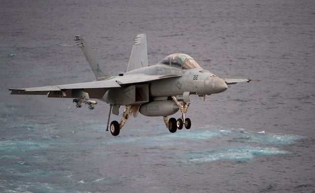 In this file photo, a Boeing EA-18G Growler lands on the deck of the USS George H.W. Bush aircraft carrier in the Atlantic Ocean on October 25, 2017.