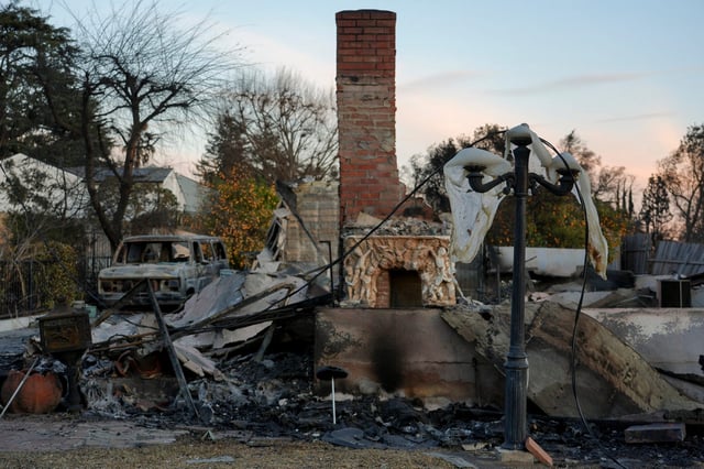 Jan 16, 2025; Altadena, CA, USA; In Altadena, residents are still waiting to get back to their homes. While some escaped the fire, many structures burned. Mandatory Credit: Megan Smith-USA TODAY