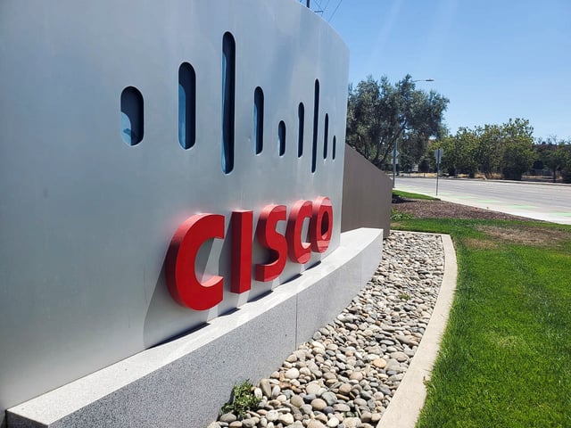 A sign bearing the logo for communications and security tech giant Cisco Systems Inc is seen outside one of its offices in San Jose, California, U.S. August 11, 2022. REUTERS/Paresh Dave/File Photo