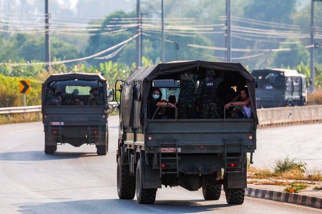 Multinational victims of scam centers, who were tricked or trafficked into working in Myanmar, travel on army trucks after they were sent to Thailand, in Phop Phra District, Tak province, Thailand February 12, 2025. REUTERS/Krit Phromsakla Na Sakolnakorn