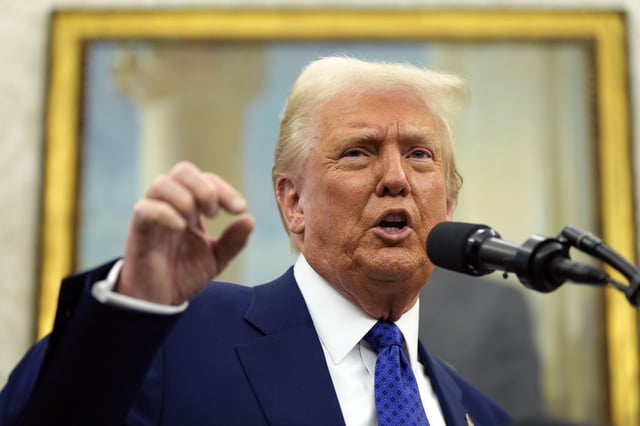 President Donald Trump speaks as Tulsi Gabbard is sworn in as the Director of National Intelligence in the Oval Office of the White House, Wednesday, Feb. 12, 2025, in Washington.