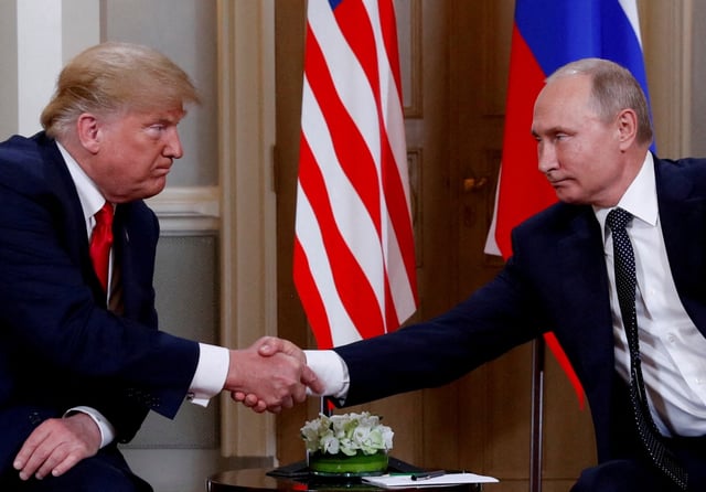 U.S. President Donald Trump and Russian President Vladimir Putin shake hands as they meet in Helsinki, Finland, July 16, 2018. REUTERS/Kevin Lamarque/File Photo