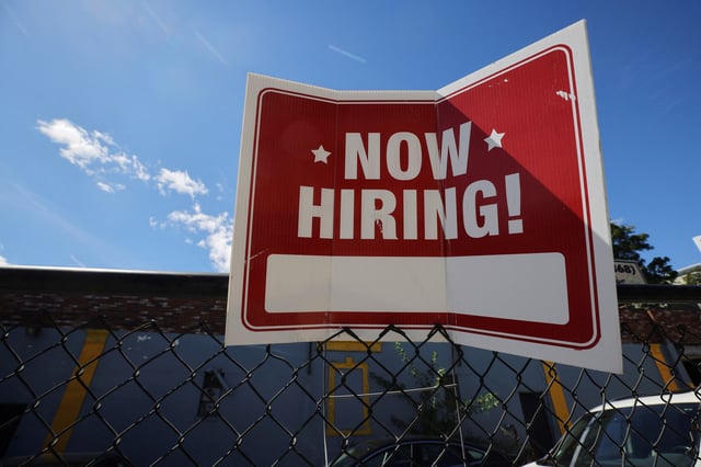 A "now hiring" sign is displayed outside Taylor Party and Equipment Rentals in Somerville, Massachusetts, U.S., September 1, 2022.     REUTERS/Brian Snyder/File Photo