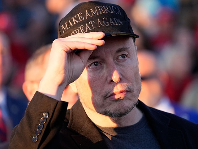 Elon Musk listens as Republican presidential nominee former President Donald Trump speaks at a campaign event at the Butler Farm Show on Oct. 5, 2024, in Butler, Pa. (AP Photo/Alex Brandon, File)