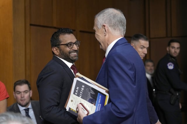 Kash Patel, President Donald Trump's choice to be director of the FBI, left, shakes the hand of Sen. Thom Tillis, R-N.C., as he departs following a confirmation hearing before the Senate Judiciary Committee at the Capitol in Washington, Thursday, Jan. 30, 2025. (AP Photo/Ben Curtis)