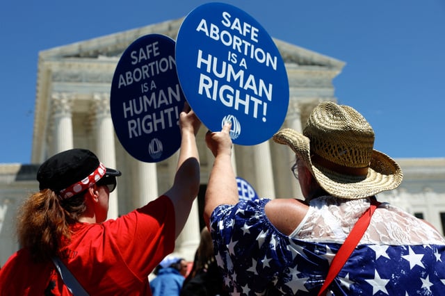 Abortion rights activists hold signs as they gather at the U.S. Supreme Court to mark the second anniversary of the Court overturning Roe v. Wade, in Washington, U.S., June 24, 2024. , U.S., June 24, 2024. REUTERS/Evelyn Hockstein