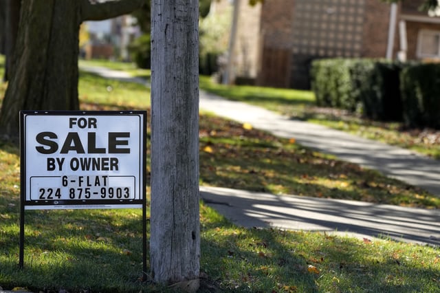 FILE - A "For Sale by Owner" sign is displayed in front of a home in Niles, Ill., Friday, Nov. 1, 2024. (AP Photo/Nam Y. Huh)