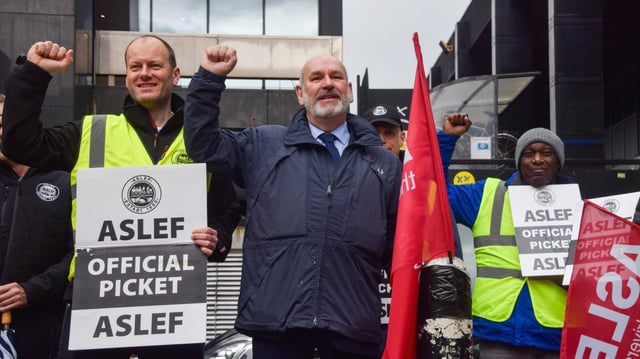 Mick Whelan of Aslef, centre, at a picket outside Euston in London last year
