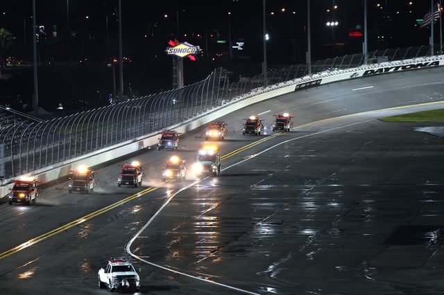 The NASCAR Track Drying Team works to dry the track during a rain delay in the NASCAR Xfinity Series Wawa 250 at Daytona International Speedway on August 27, 2021 in Daytona Beach, Florida.