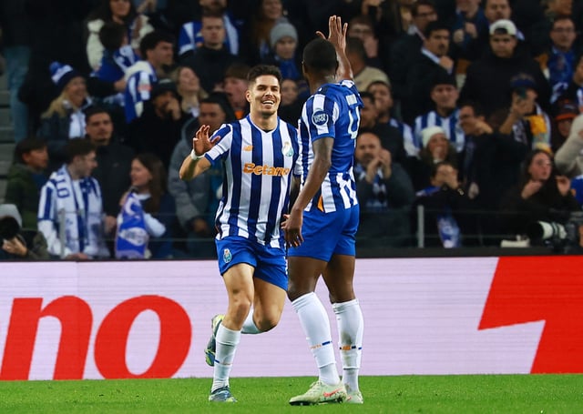 Soccer Football - Europa League - Knockout Phase Playoff - First Leg - FC Porto v AS Roma - Estadio do Dragao, Porto, Portugal - February 13, 2025 FC Porto's Francisco Moura celebrates scoring their first goal with FC Porto's Otavio REUTERS/Pedro Nunes