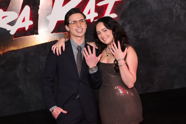 Tanner Buchanan and Mary Mouser arrive at Netflix's "Cobra Kai" Series Finale Premiere Event at The Egyptian Theatre Hollywood on February 12, 2025 in Los Angeles, California.