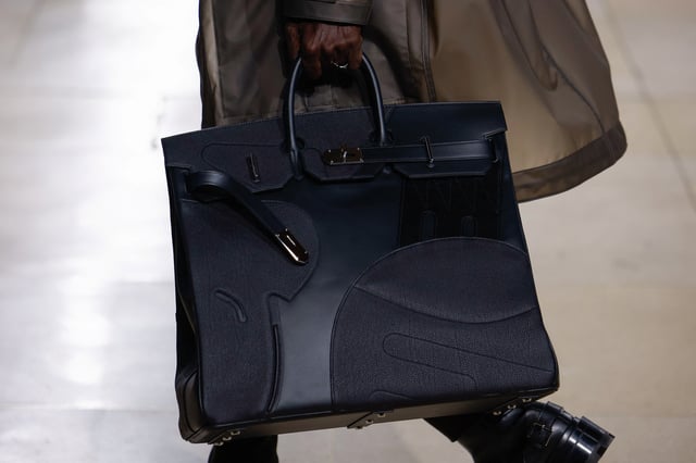 A model presents a bag creation by designer Veronique Nichanian as part of her Men's Winter 2024 collection at the runway show for fashion house Hermes during Men's Fashion Week in Paris, France, January 20, 2024. REUTERS/Sarah Meyssonnier/File Photo