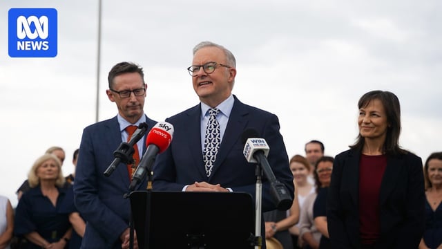 Man smiling at press conference