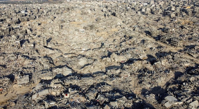 A drone view shows houses and buildings lying in ruins, following a ceasefire between Israel and Hamas, in Jabalia in the northern Gaza Strip, January 19, 2025. REUTERS/Mahmoud Al-Basos/File Photo