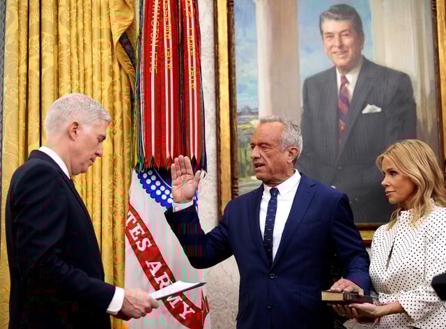 Supreme Court Justice Neil Gorsuch swears in Robert F. Kennedy Jr. as secretary of Health and Human Services at the White House on Feb. 13, 2025. With Kennedy is his wife, actress Cheryl Hines.