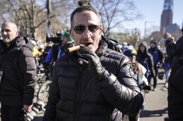 Philadelphia Eagles executive vice president and general manager Howie Roseman enjoys a cigar during the team's NFL football Super Bowl 59 parade and celebration Feb. 14, 2025, in Philadelphia.