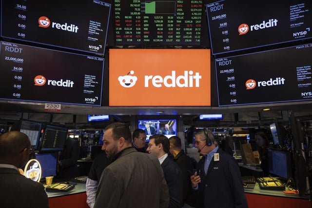Reddit Inc. signage is seen on the New York Stock Exchange trading floor, before Reddit IPO,  March. 21, 2024. On Thursday, Reddit CEO Steve Huffman announced that the San Francisco social network will introduce a paywall this year to make content on some subreddits available only to subscribers. 