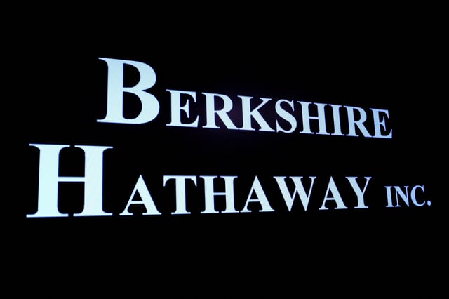 Berkshire Hathaway logo is displayed on a screen on the floor of the New York Stock Exchange (NYSE) in New York City, U.S., May 10, 2023.  REUTERS/Brendan McDermid/File Photo