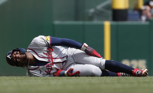 May 26, 2024; Pittsburgh, Pennsylvania, USA;  Atlanta Braves right fielder Ronald Acuña Jr. (13) reacts after suffering an apparent injury on a steal attempt against the Pittsburgh Pirates during the first inning at PNC Park. Mandatory Credit: Charles LeClaire-USA TODAY Sports/File Photo