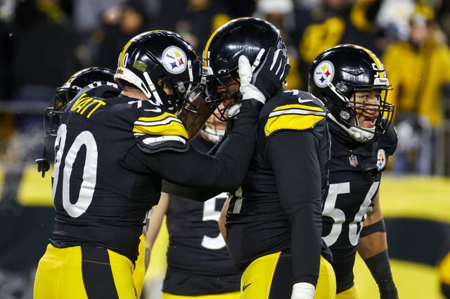 PITTSBURGH, PENNSYLVANIA - JANUARY 04: T.J. Watt #90 of the Pittsburgh Steelers reacts with Preston Smith #91 after a sack in the second quarter of a game at Acrisure Stadium on January 04, 2025 in Pittsburgh, Pennsylvania.