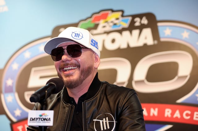 Singer and Trackhouse Racing Team co-owner Pitbull speaks to the media during a press conference after the NASCAR Cup Series Daytona 500 was postponed due to weather at Daytona International Speedway on February 18, 2024 in Daytona Beach, Florida.