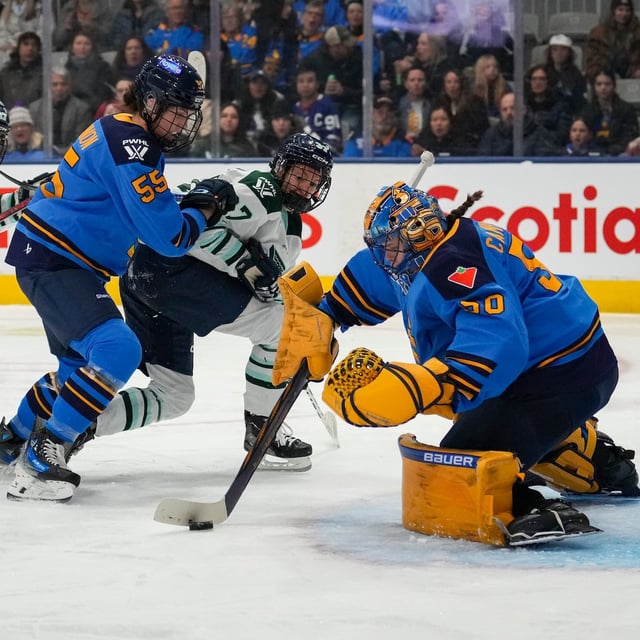 Toronto Sceptres goaltender Kristen Campbell (50) stops Boston Fleet's Theresa Schafzahl (37) as Sceptres' Rylind MacKinnon (55) defends during first period PWHL hockey action in Toronto on Friday Feb. 14, 2025. THE CANADIAN PRESS/Arlyn McAdorey