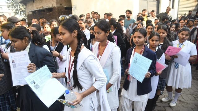 Outside St. Dominic Savio's High School Danapur in Patna where students of Class 10 entering the exam centre. 