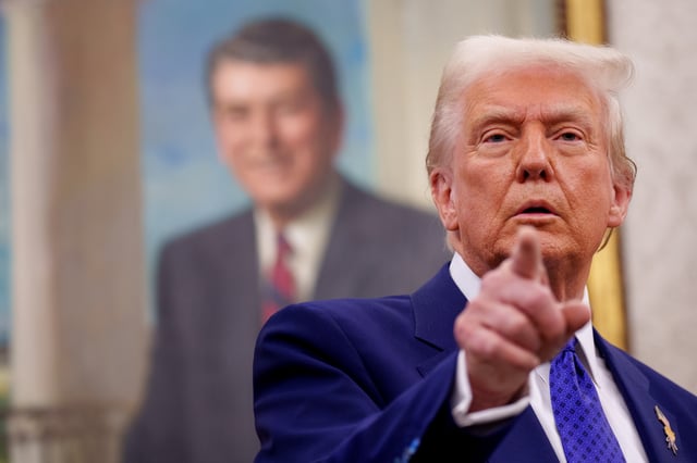 U.S. President Donald Trump takes a question from a reporter after Tulsi Gabbard is sworn in as Director of National Intelligence in the Oval Office at the White House on February 12, 2025 in Washington, DC.
