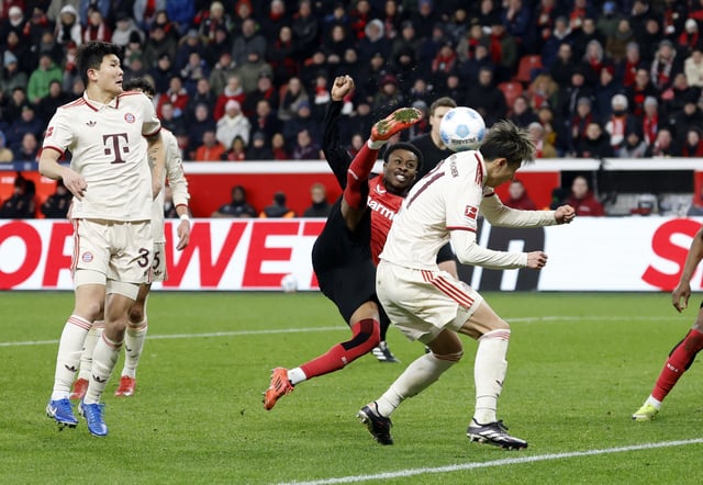 Soccer Football - Bundesliga - Bayer Leverkusen v Bayern Munich - BayArena, Leverkusen, Germany - February 15, 2025 Bayer Leverkusen's Nathan Tella shoots at goal REUTERS/Heiko Becker